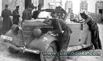 French POWs with a Ford staff car