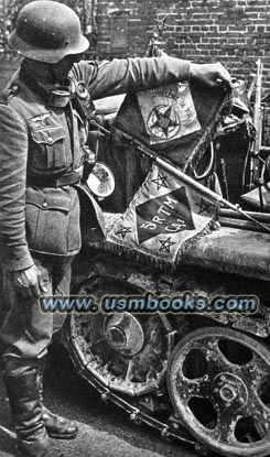 Wehrmacht soldier with a captured French Regimental Standard