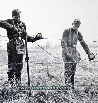 RAD men taking down barbed wire on the German-Alsace border